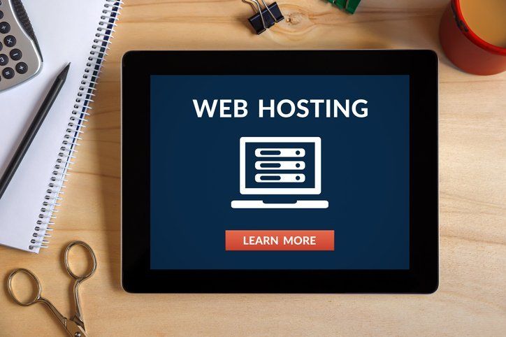 A tablet with the word web hosting on it