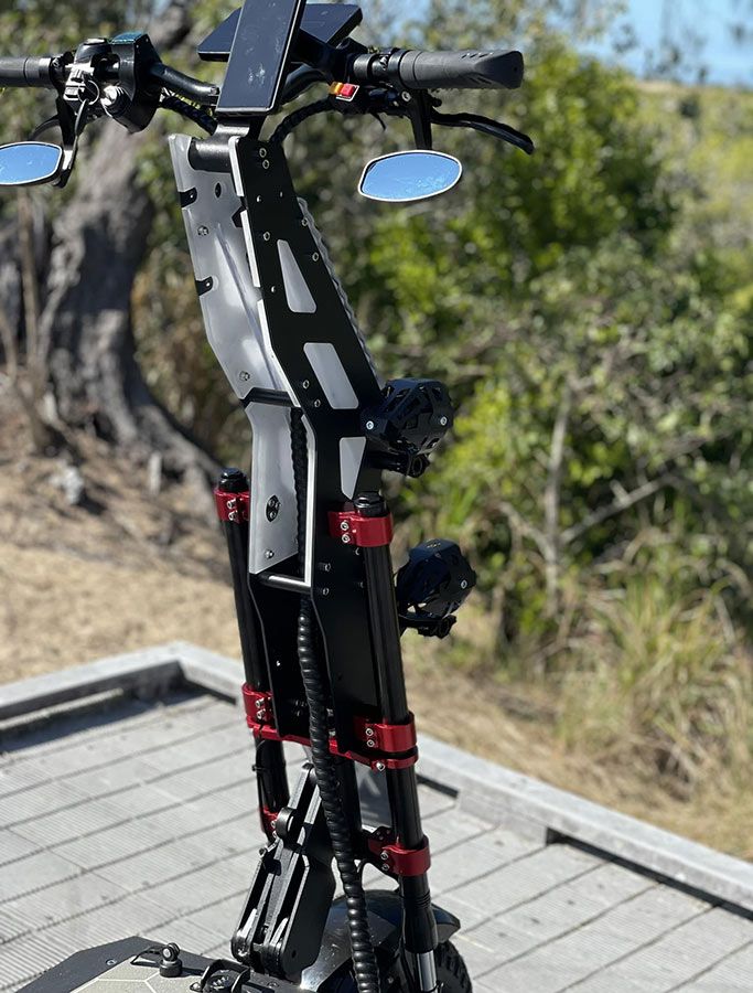 An Electric Scooter is Parked on a Wooden Deck — EVA Motors in Paget, QLD