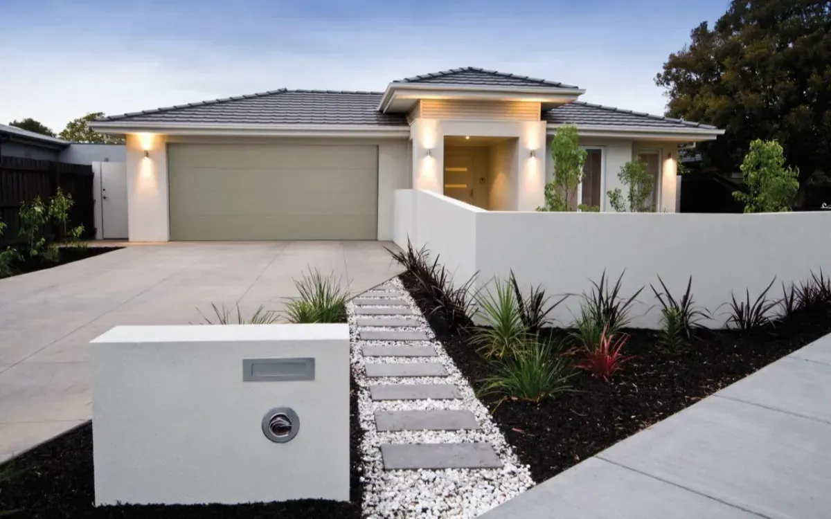 A House With a Mailbox in Front of It — Hastings Garage Door Services in Port Macquarie