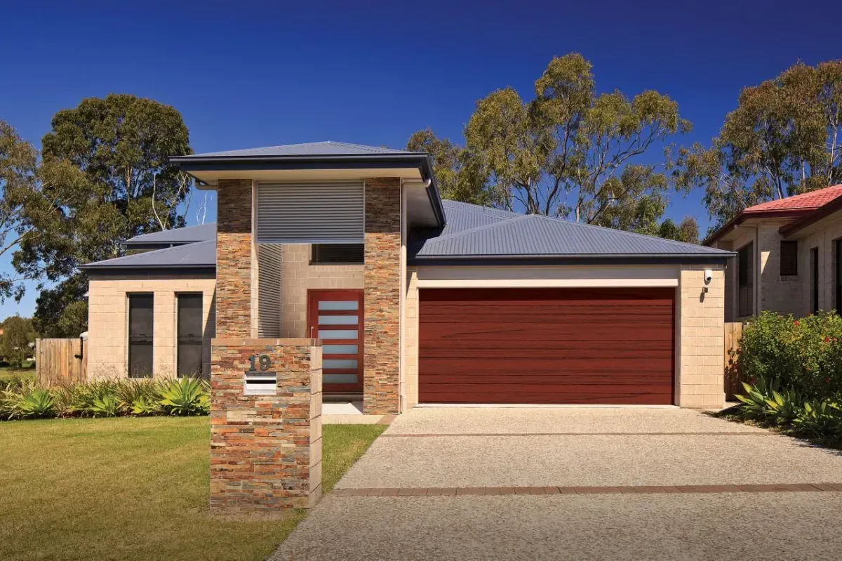 A House With a Red Garage Door and a Mailbox — Hastings Garage Door Services in Port Macquarie