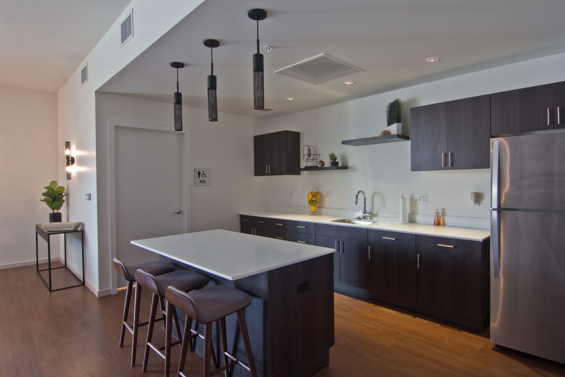 Kitchen with island and high chairs
