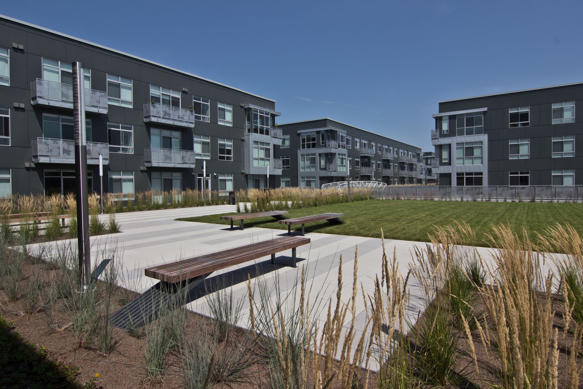 DuCharme Place -  Apartment exterior with benchs