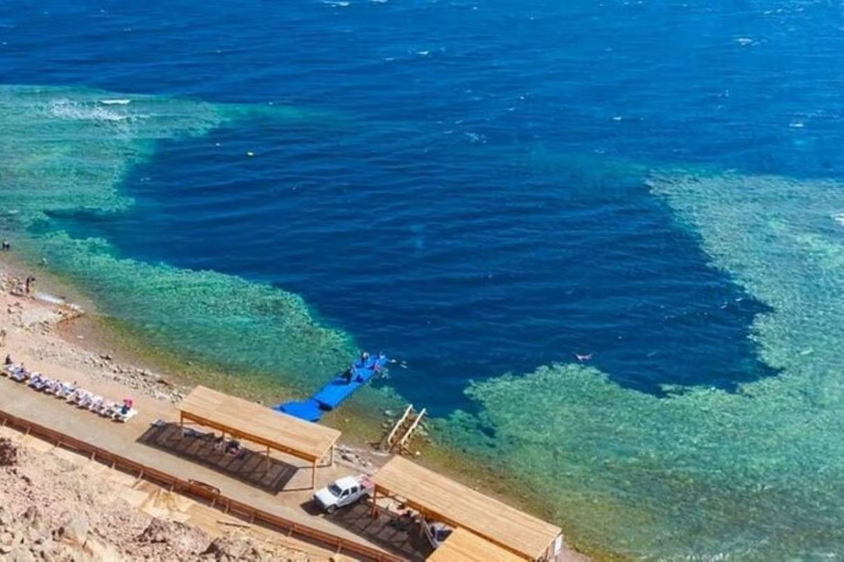 Sharm El Sheikh Red Sea diving experience with colorful coral reefs, clear water ز