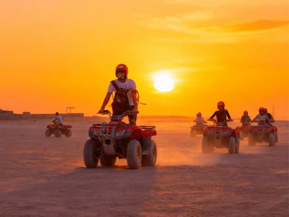Hurghada desert sunrise with golden mountains, camels and beautiful Egyptian desert landscape.
