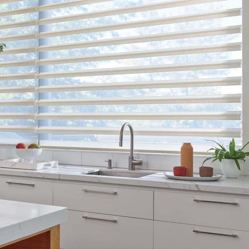 Kitchen Window Featuring Pirouette Style Shades in College Station, TX Residence
