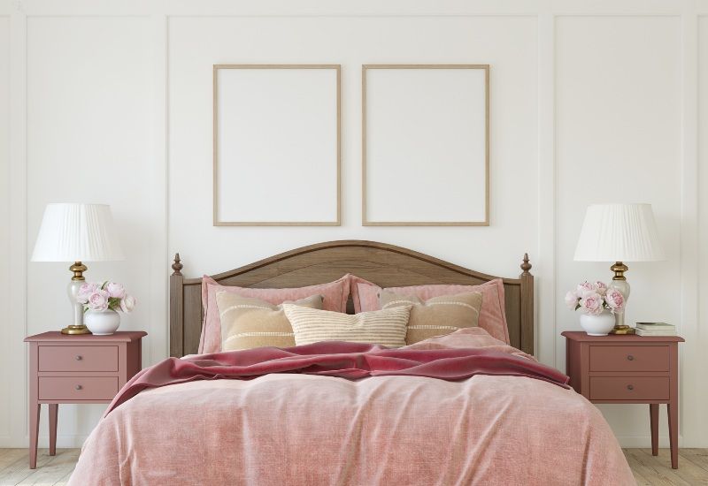 Custom Bedding featured in a stylish bedroom with layered pink bedding in College Station, TX