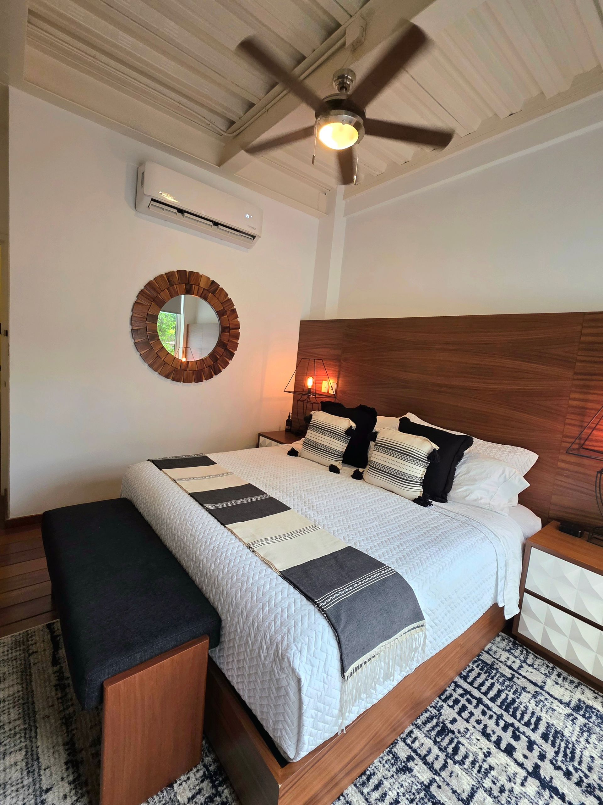 King bed and ceiling fan in the Muse suite at AVA19 in Puerto Vallarta