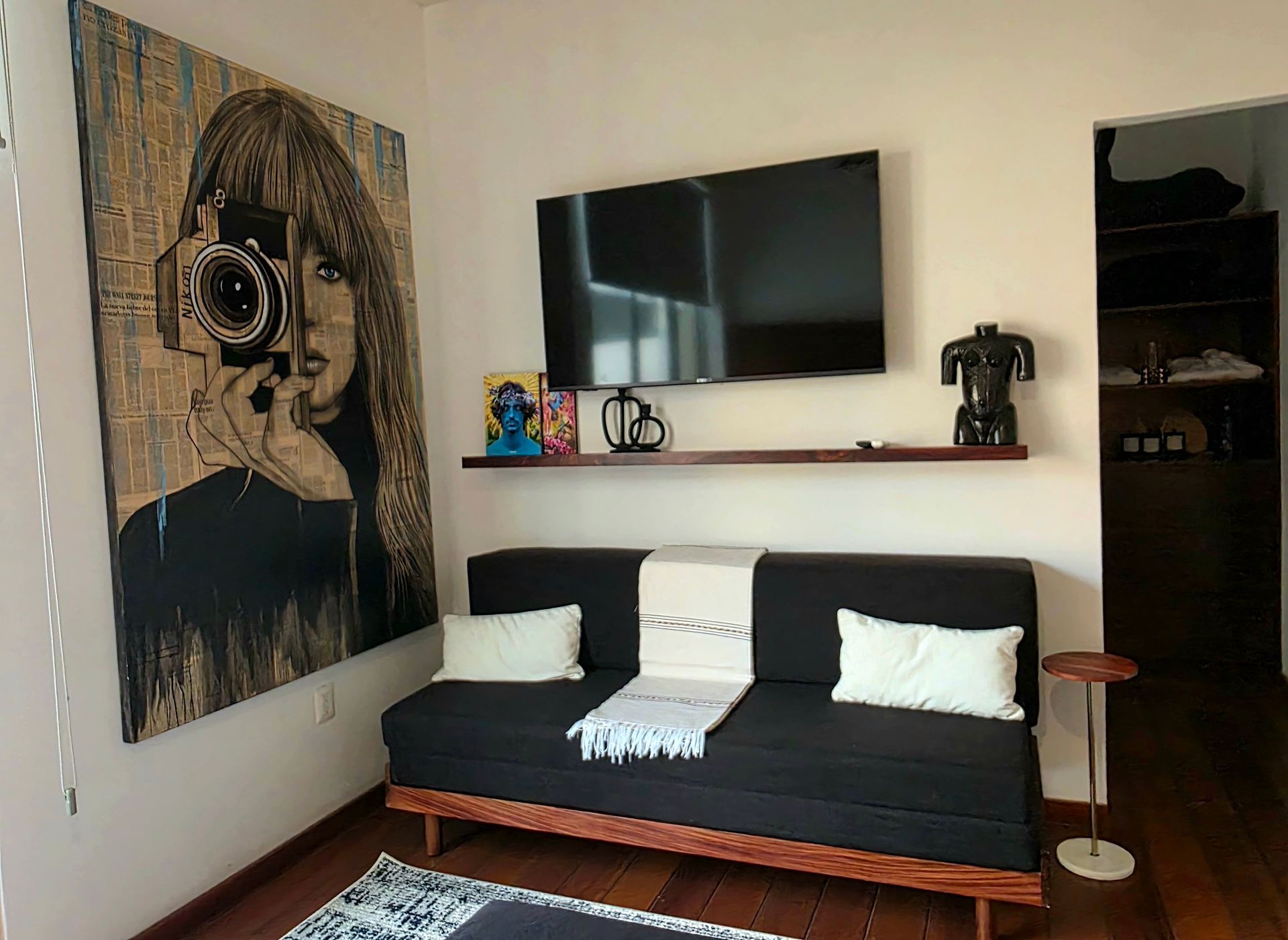 Queen futon seating and television in the Muse suite at AVA19 in Puerto Vallarta