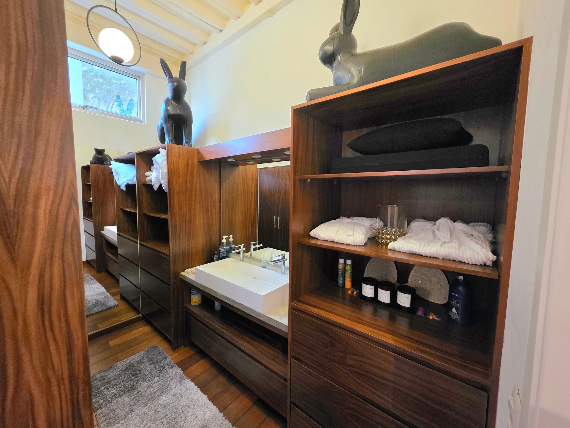 Closet shelving and drawers in the Muse king suite at AVA19 in Puerto Vallarta