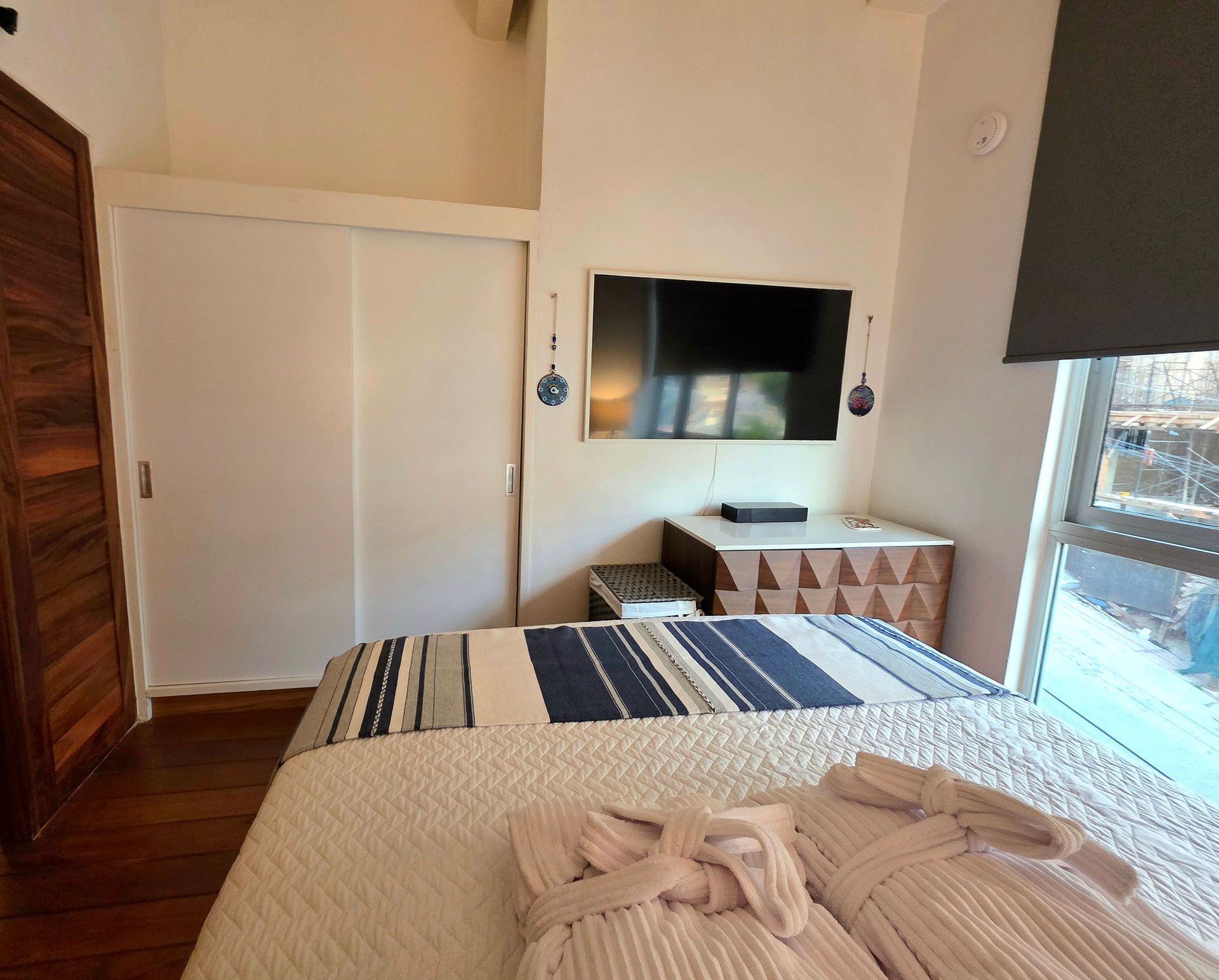 Bedroom lighting in the Cove queen room at AVA19 in Puerto Vallarta