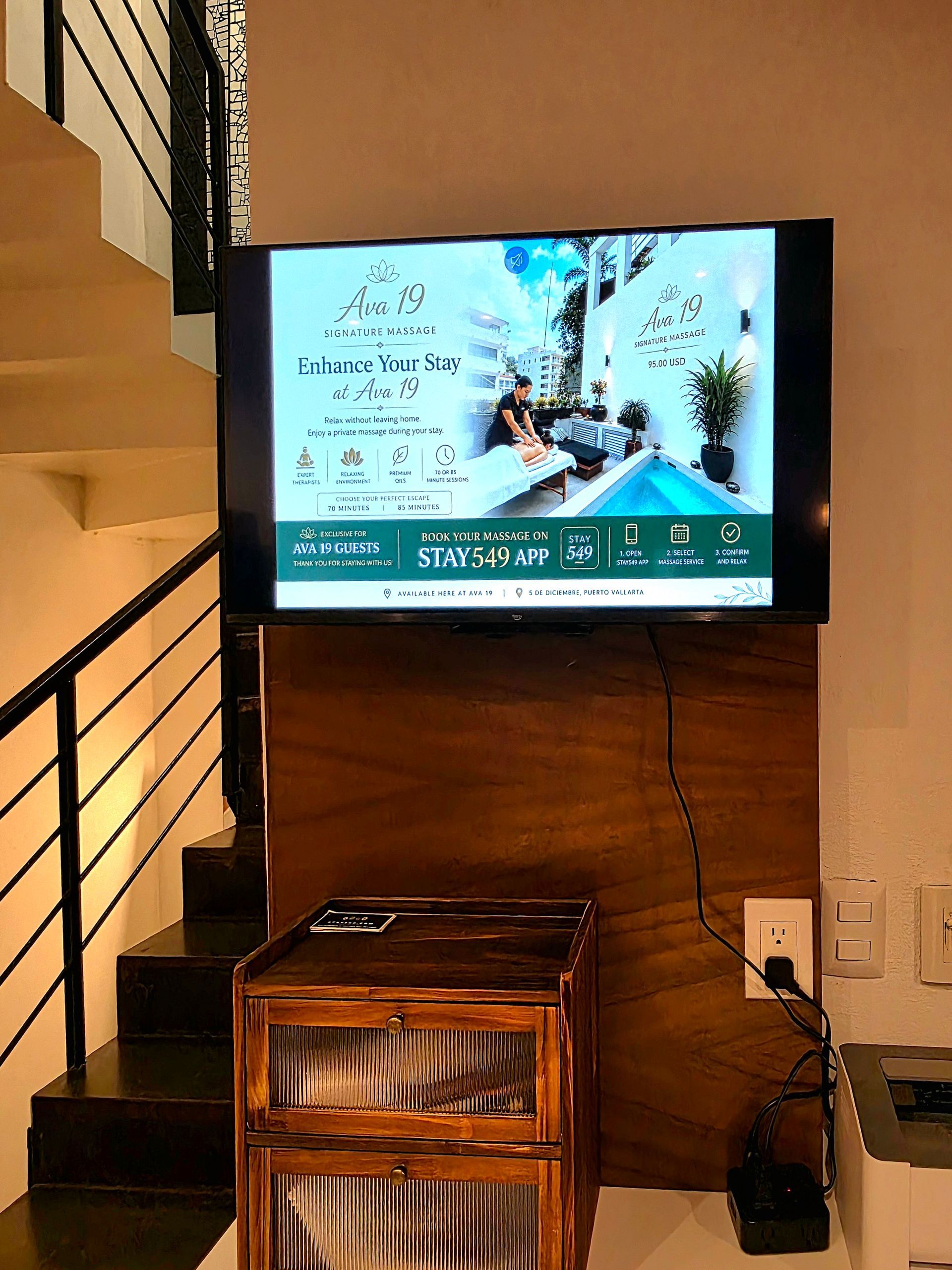 Lounge and staircase on the main floor of AVA19 in Puerto Vallarta