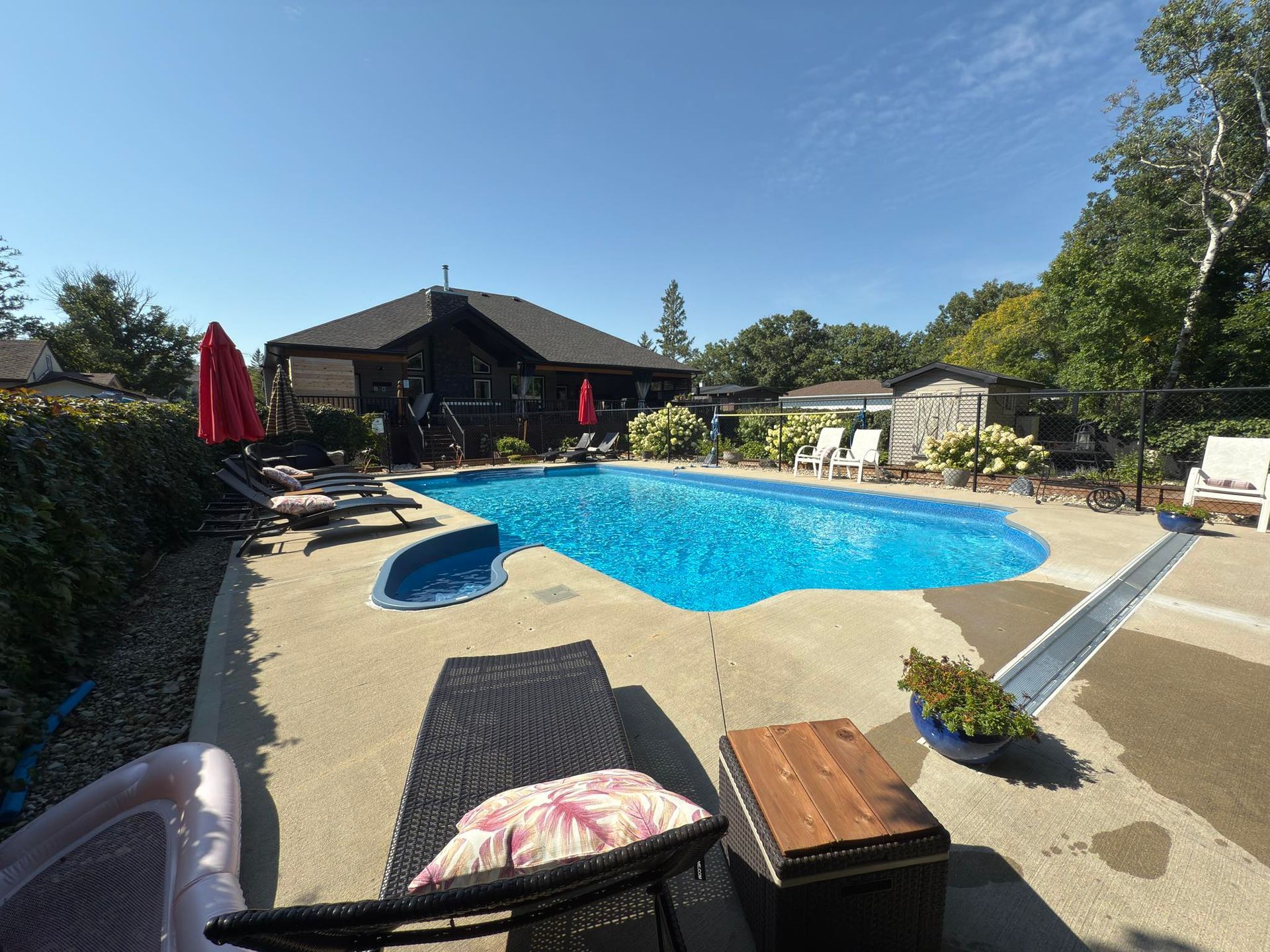 Seasonal outdoor pool and sun loungers at Stay549 Winnipeg