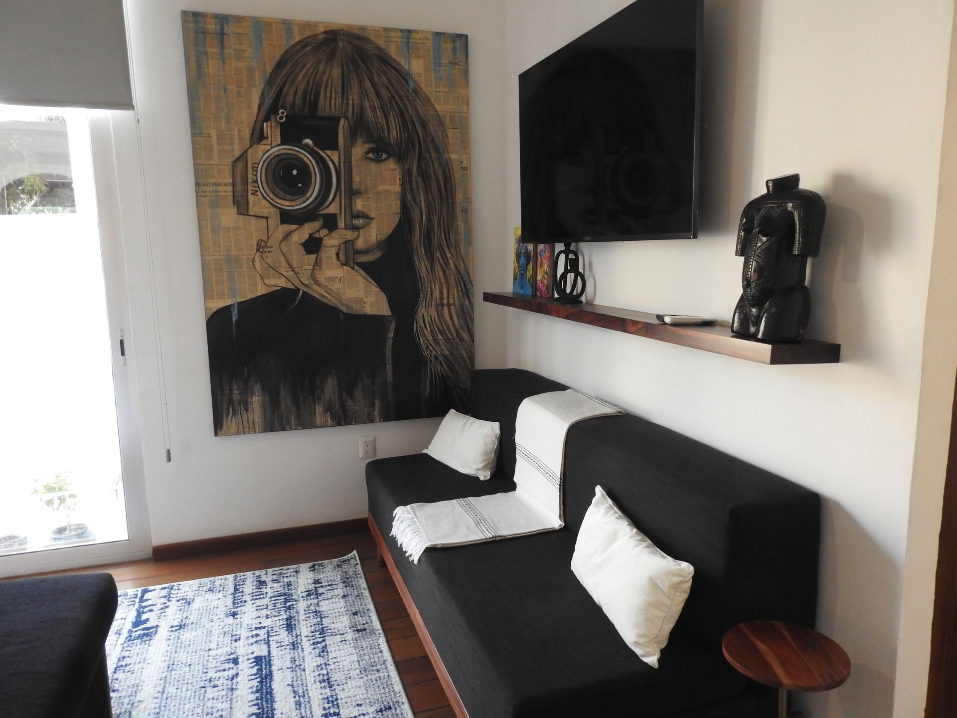 Futon seating area in the Muse king suite at AVA19 in Puerto Vallarta