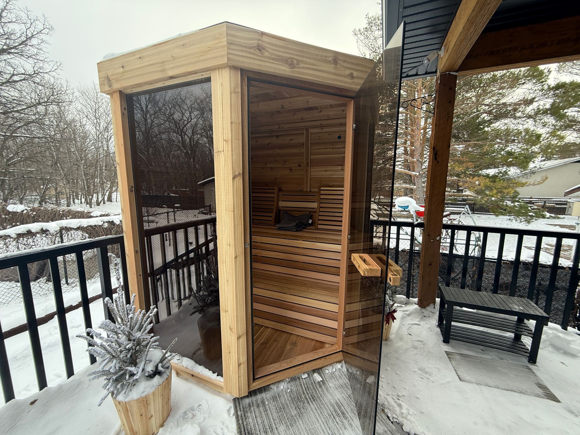 Stay549 cedar sauna on the outdoor deck in winter