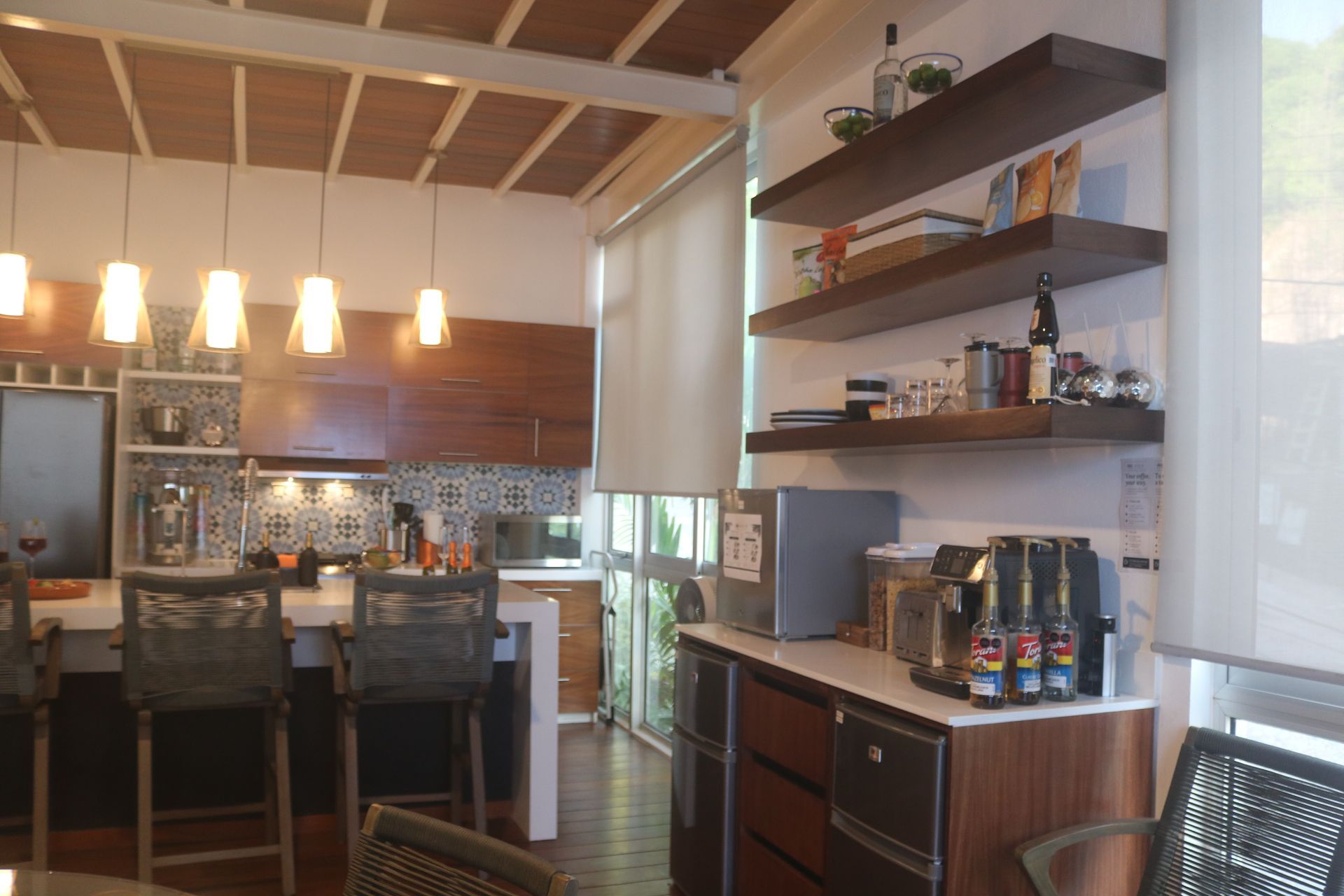 Kitchen shelving and dining area at AVA19 in Puerto Vallarta
