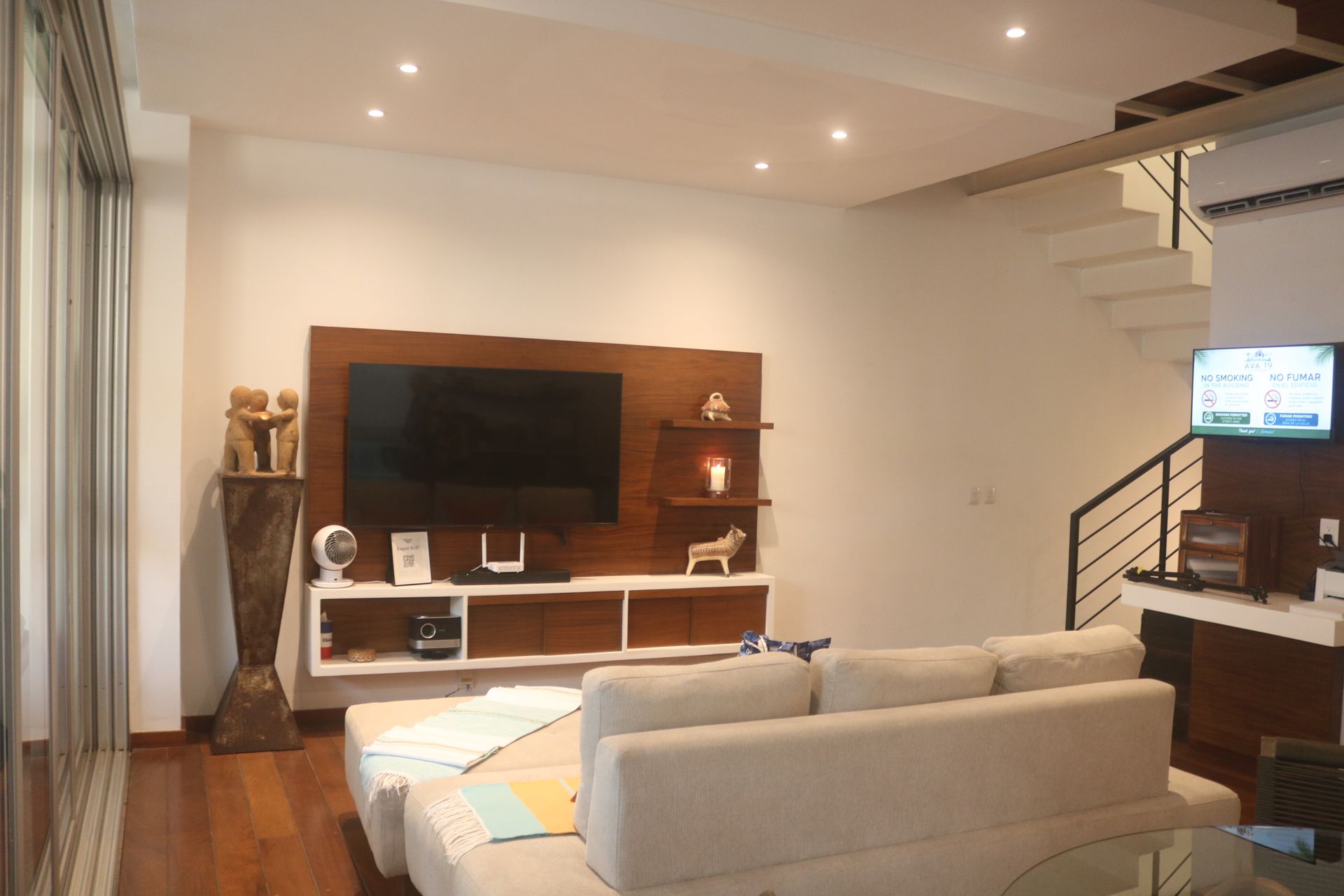 Television and wood cabinetry on the main floor of AVA19 in Puerto Vallarta