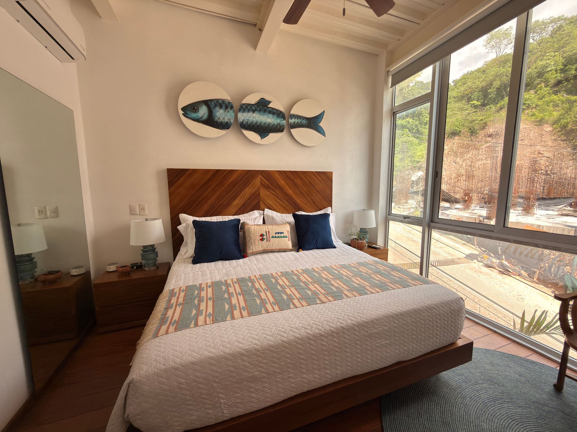 Twin Tide king bedroom with floor-to-ceiling windows at AVA19 in Puerto Vallarta