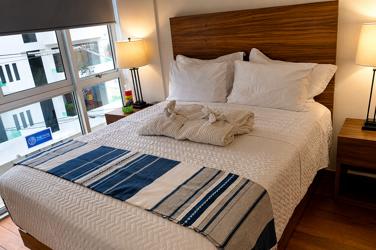 Bedroom and hardwood floors in the Cove queen room at AVA19 in Puerto Vallarta