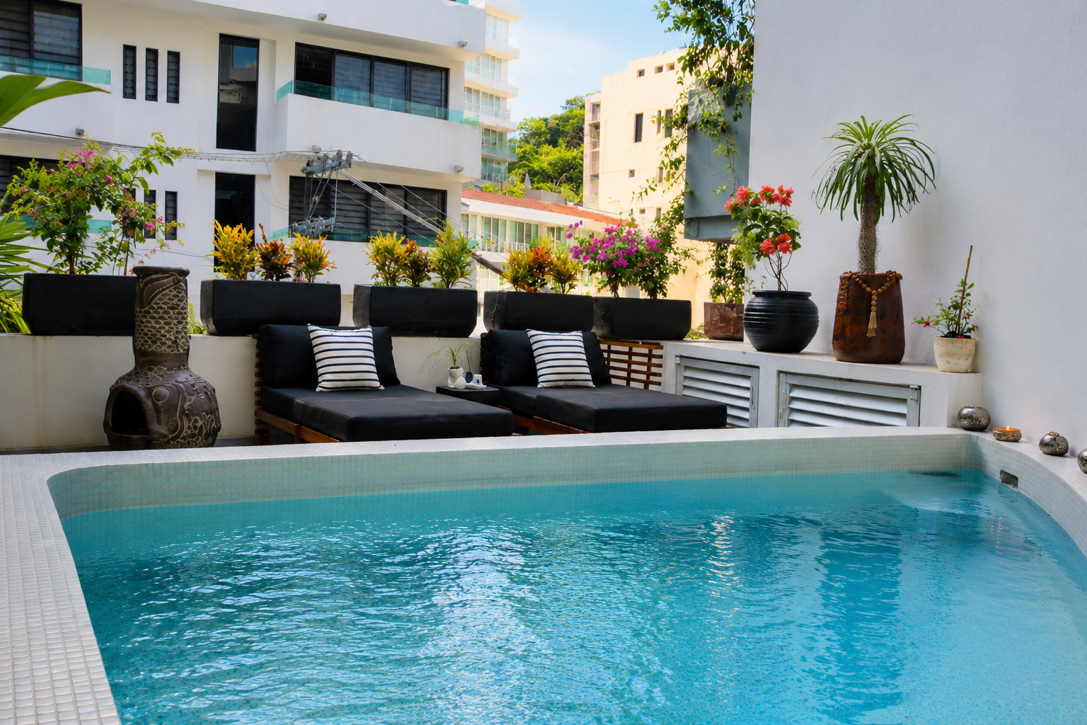 Outdoor sofa and plants at AVA19 in Puerto Vallarta