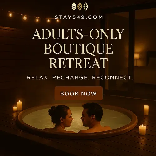 Adults-only boutique retreat ad with a candlelit hot tub and a couple relaxing at night