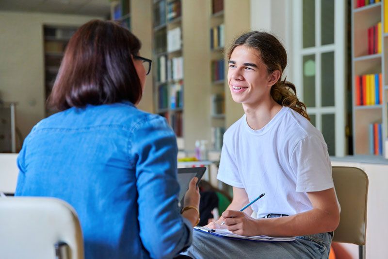 Student working with their college counselor