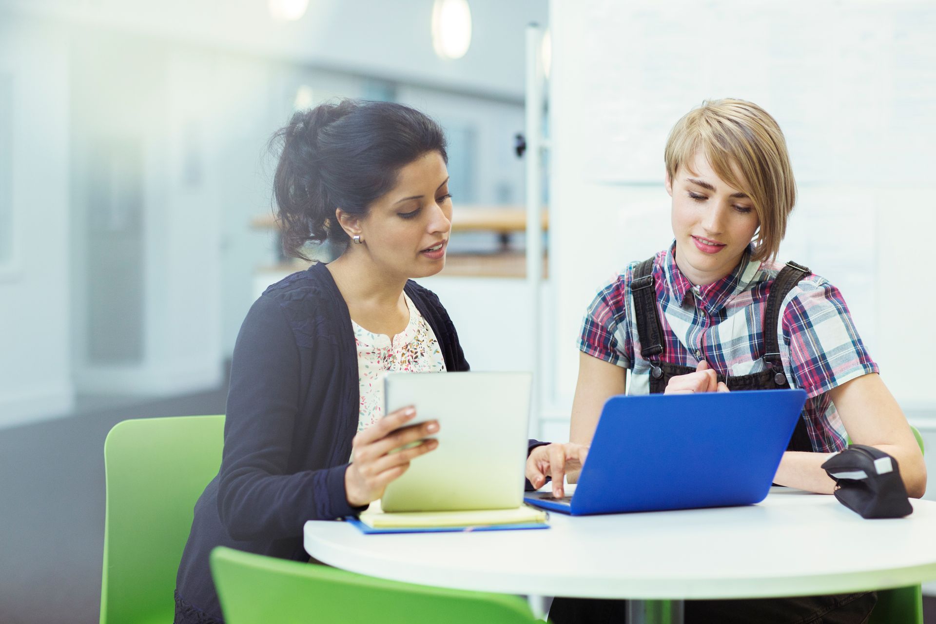 High school counselor meeting with a student