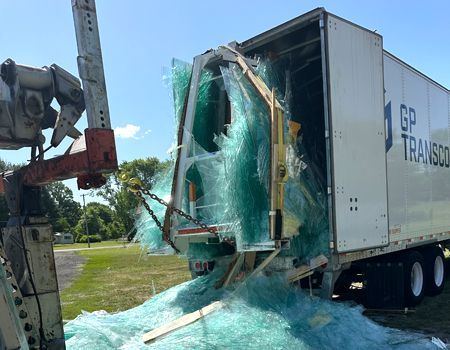 A gp transport truck has been damaged by a crane