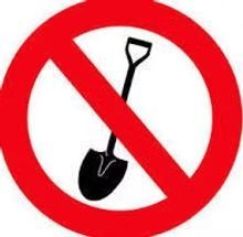 Red prohibition sign over a black shovel, indicating no shovels allowed.