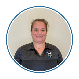 Portrait of a smiling person in a dark polo shirt inside a blue circular border