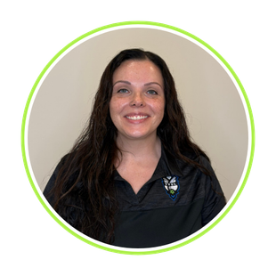 Smiling woman in a black shirt with a logo, framed by a green circular border on a beige background