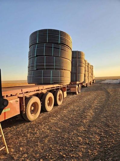 Elsam road train delivering pipe