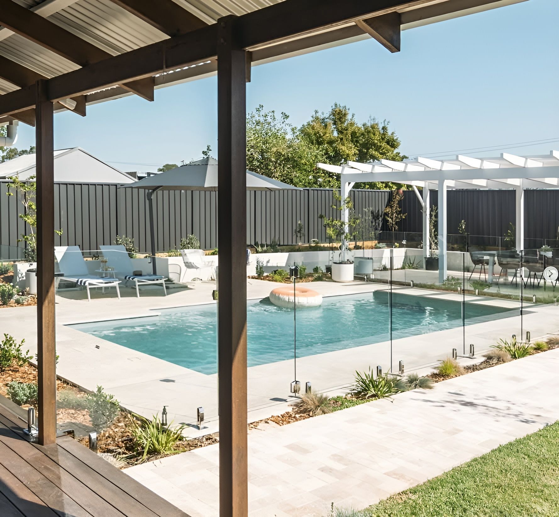Modern Backyard Pool with Patio and Garden Beds — New Vision Pools in Thrumster, NSW