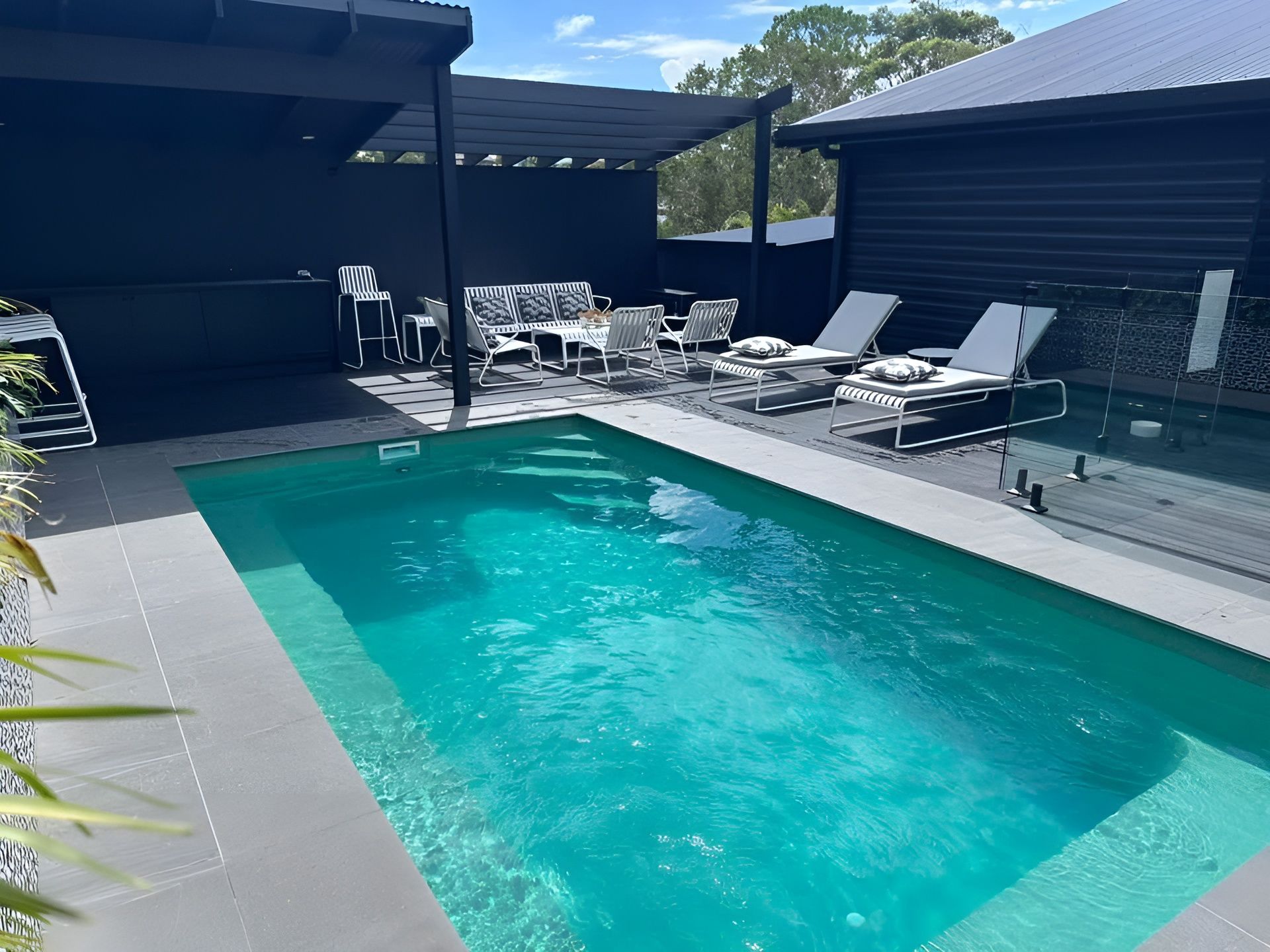 Modern Patio with A Turquoise Swimming Pool — New Vision Pools in Port Macquarie, NSW
