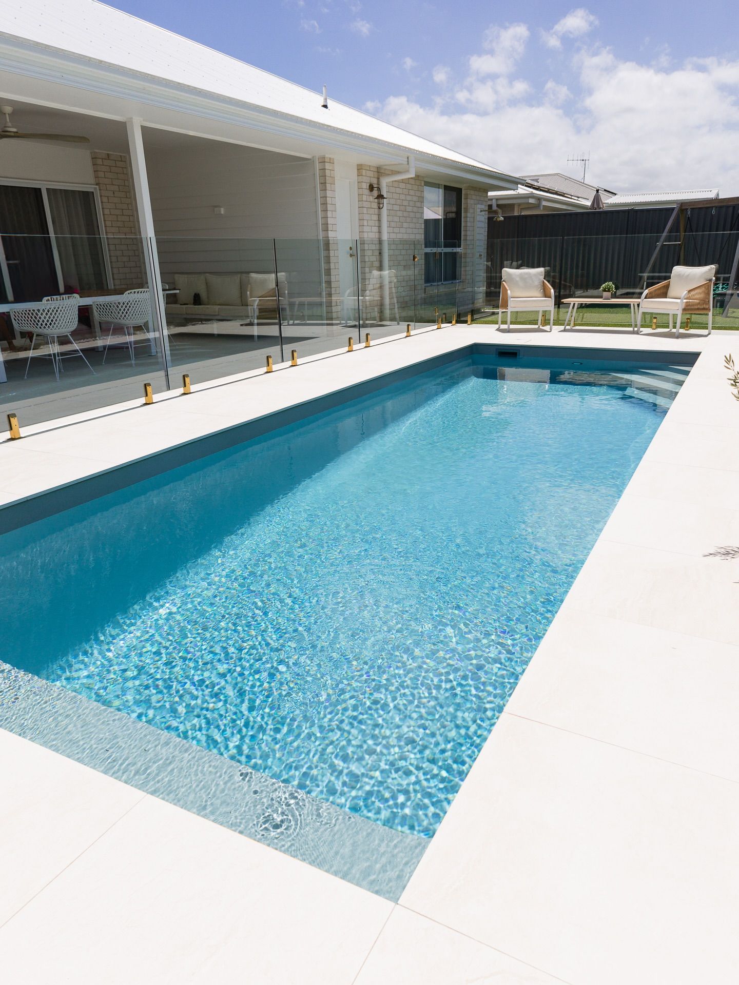Modern Backyard Patio with A Rectangular Blue Swimming Pool — New Vision Pools in Port Macquarie, NSW