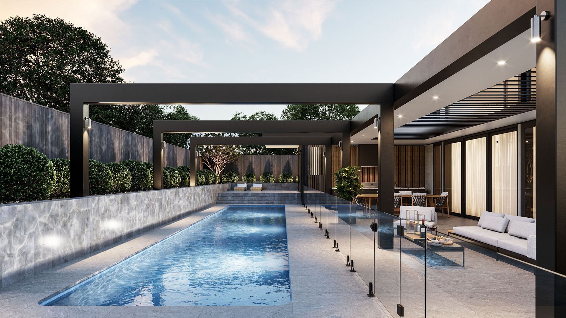 Modern Poolside Patio with Glass Railing and Shaded Pergola at Sunset — New Vision Pools in Port Macquarie, NSW