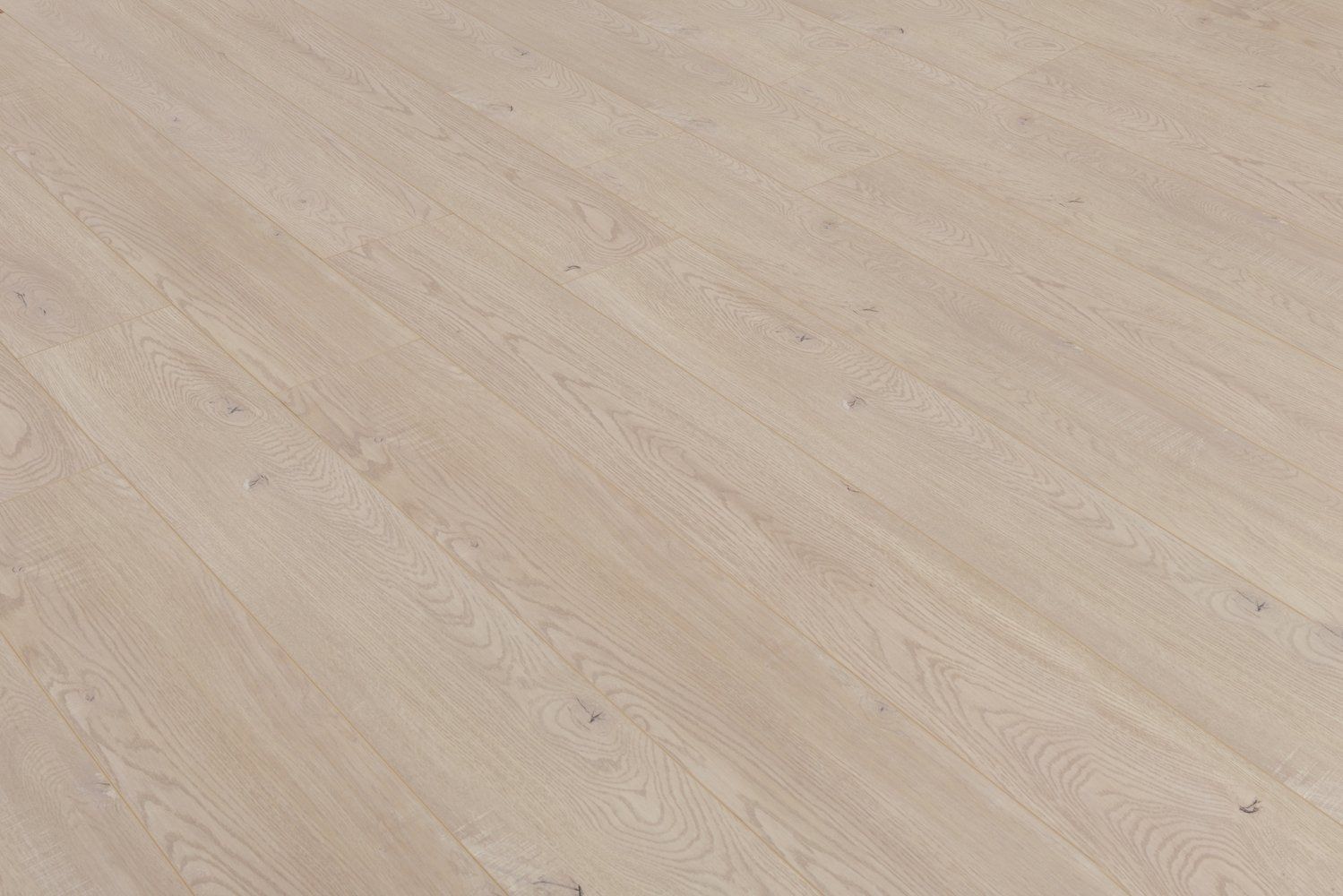 A close up of a white wooden floor with a diagonal pattern.
