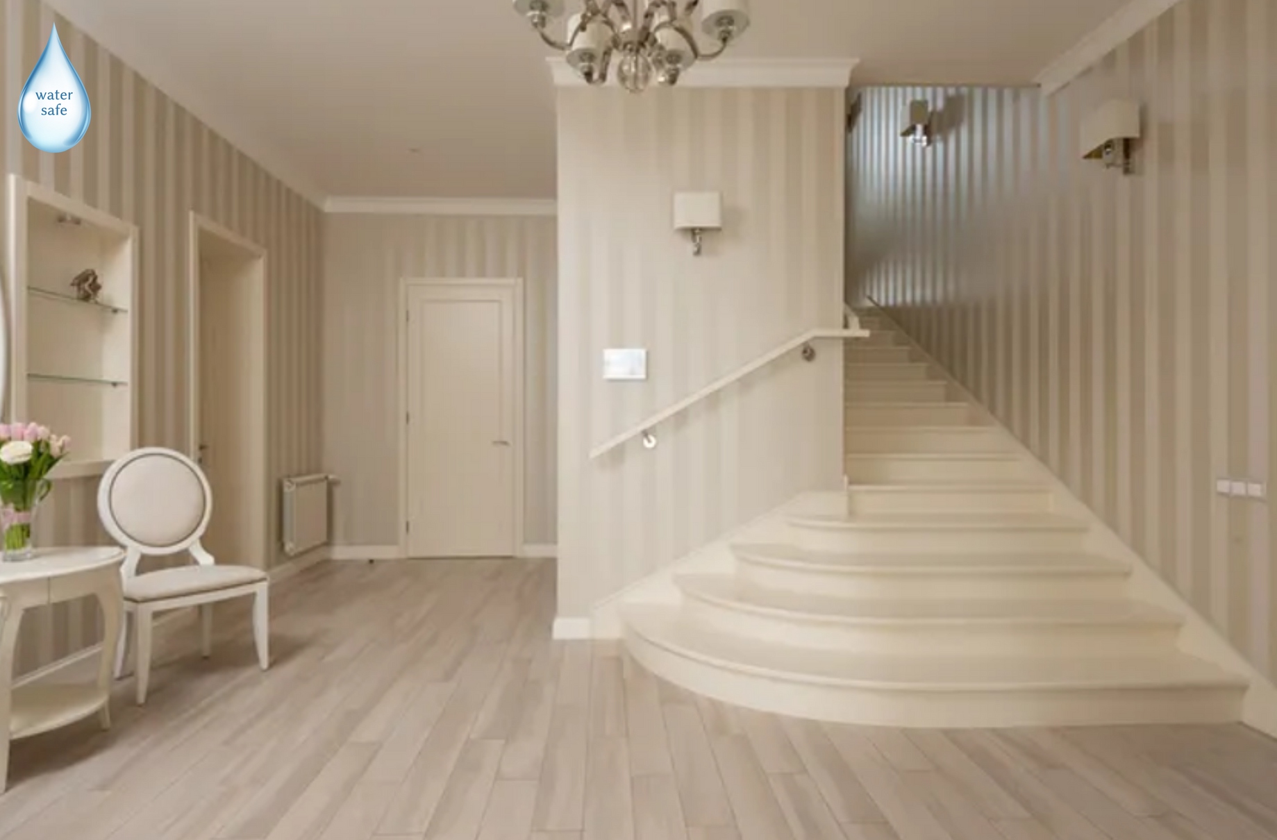 A hallway with stairs leading up to the second floor of a house.