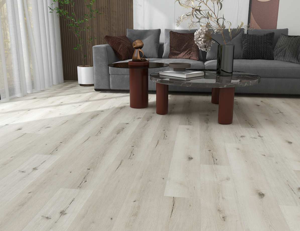 A living room with hardwood floors , a couch , and a coffee table.