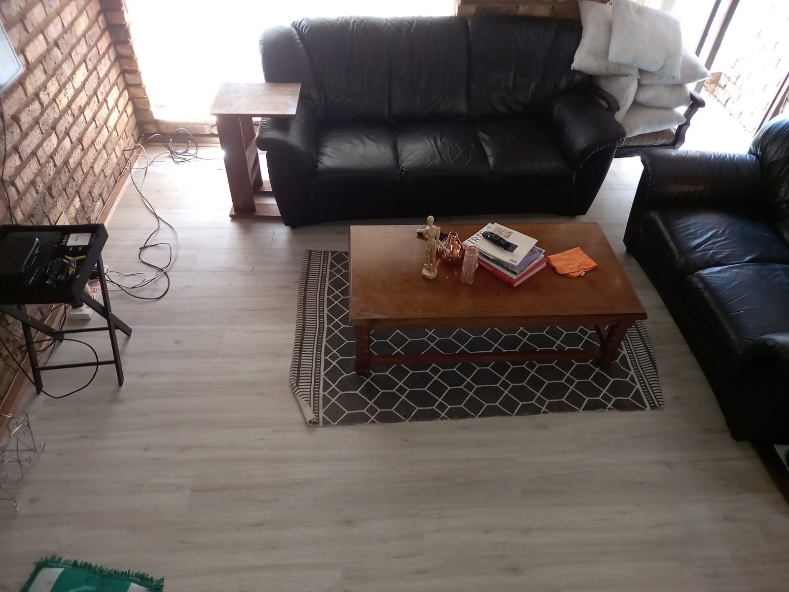An aerial view of a living room with a couch and a coffee table