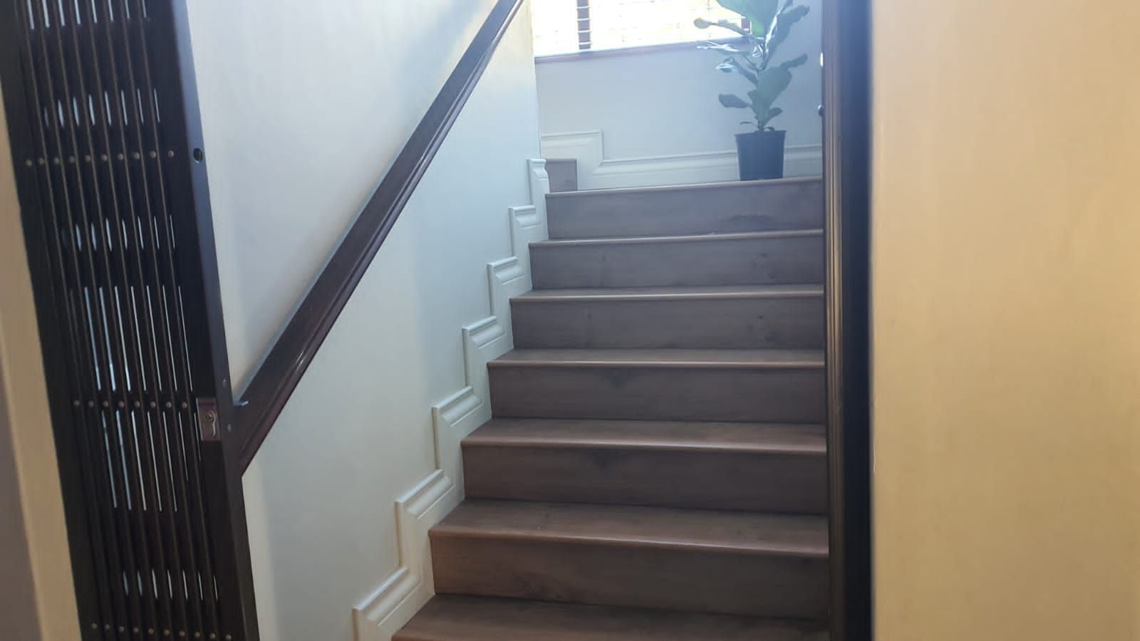 A set of stairs leading up to the second floor of a building
