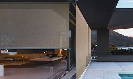A modern house with a swimming pool and a large window.