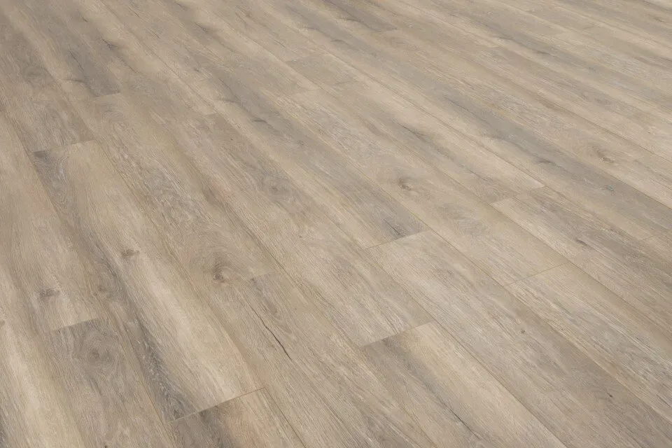 A close up of a wooden floor in a room.