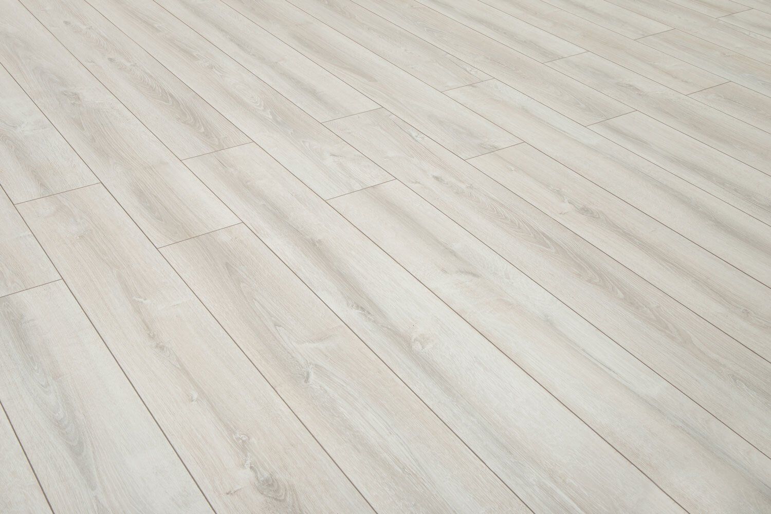 A close up of a white wooden floor in a room.