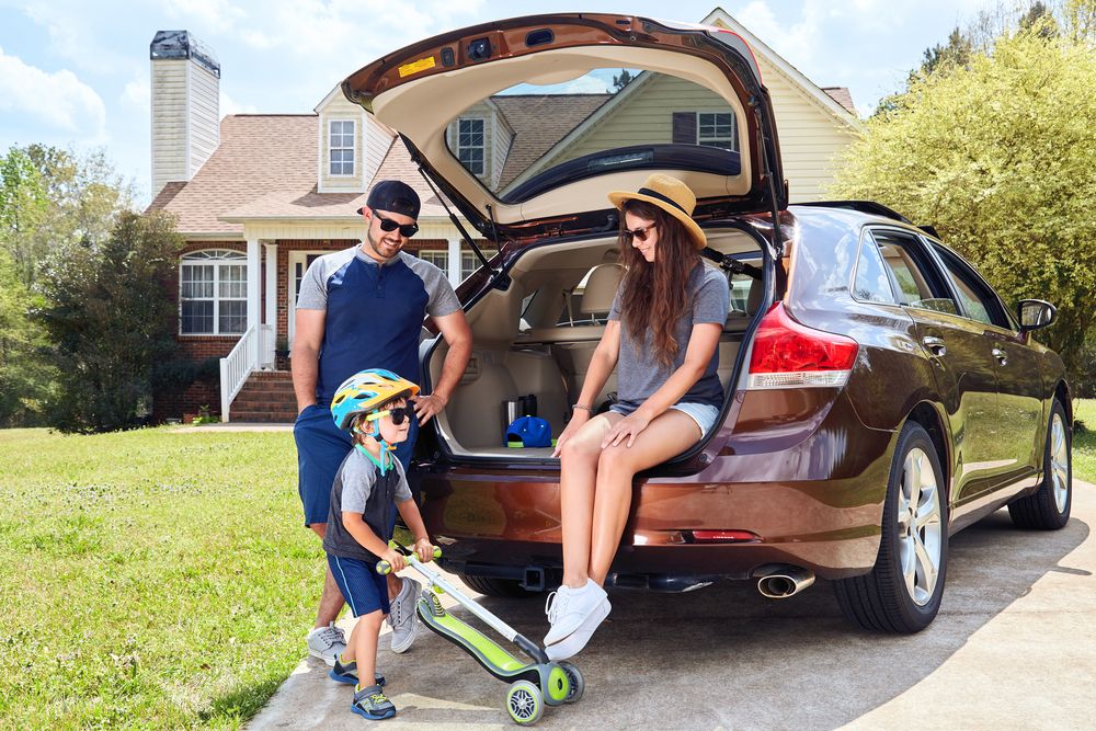 Behind a Family Their a Open Car Trunk That Has Gas Strut on the Side — Strut Re-gas Mackay In Ooralea, QLD