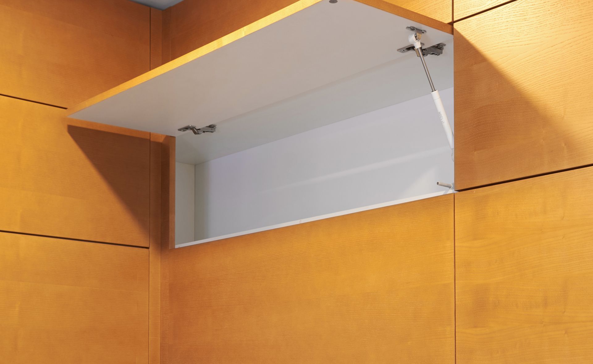 A Kitchen With a Stainless Steel Hood Above the Cabinets — Strut Re-gas Mackay In Sarina, QLD