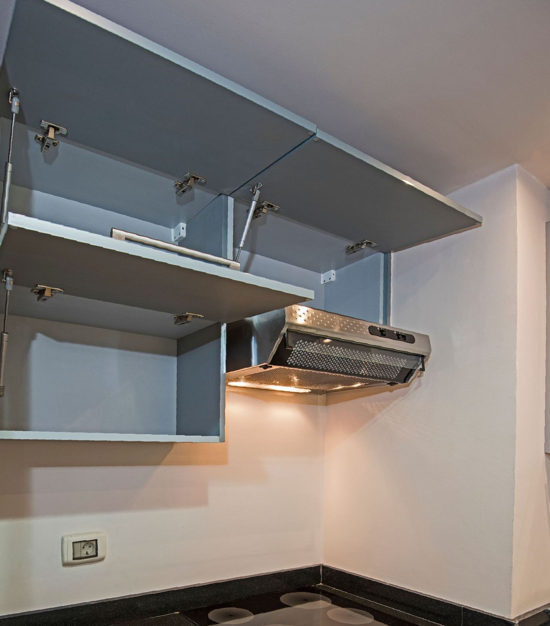 Grey Cabinets on top of an exhaust — Strut Re-gas Mackay In Moranbah, QLD