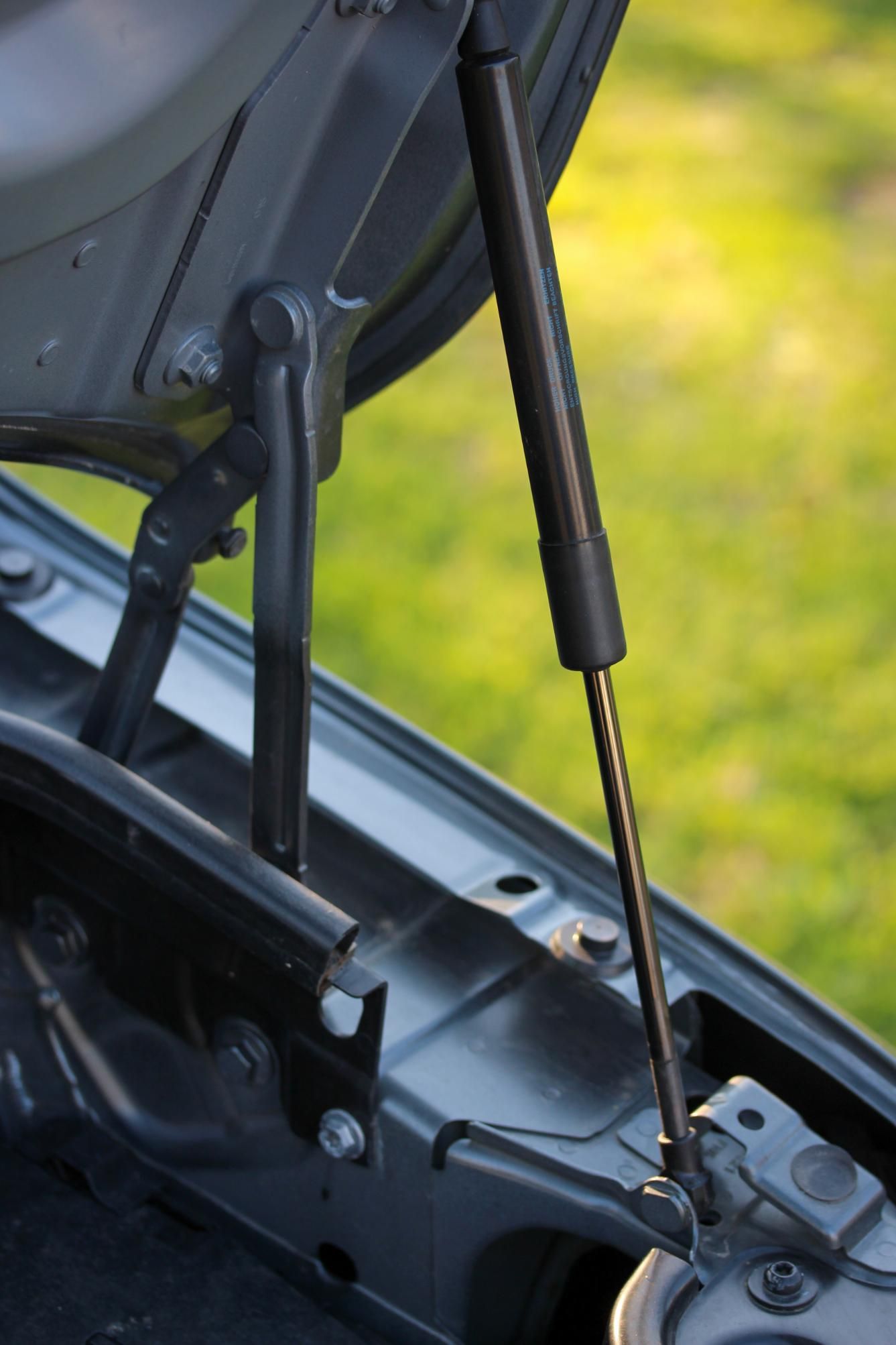 A Close Up of a Car With the Trunk Open — Strut Re-gas Mackay In Ooralea, QLD