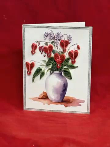 Greeting card with watercolor of red flowers in a white vase on a red background