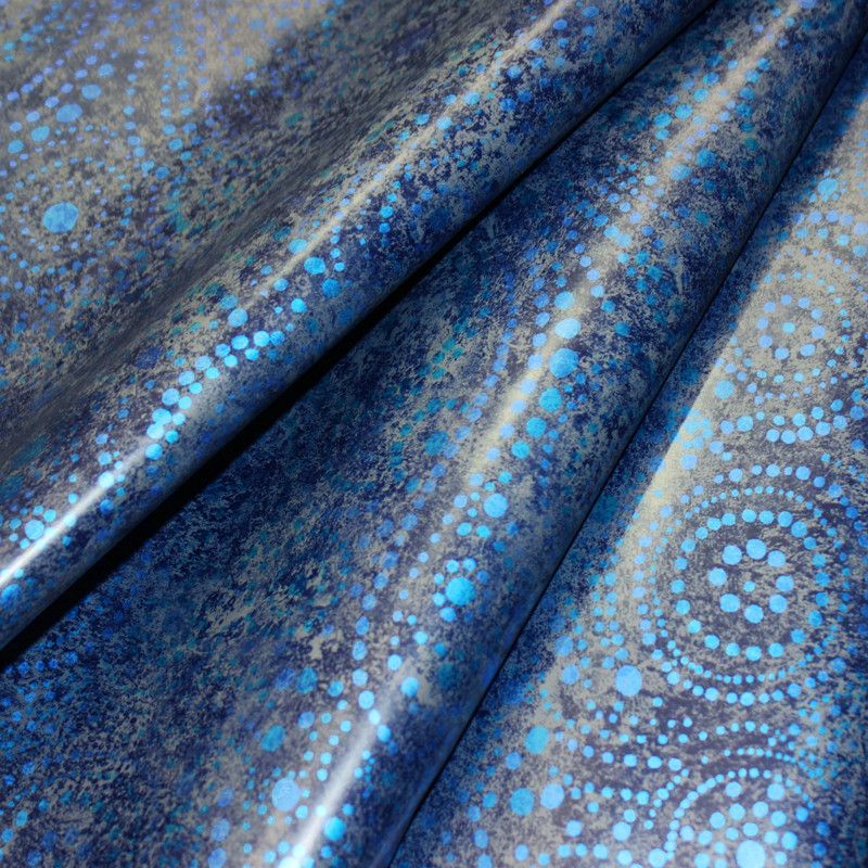 Blue leather with metallic sheen, speckled with turquoise dot patterns.