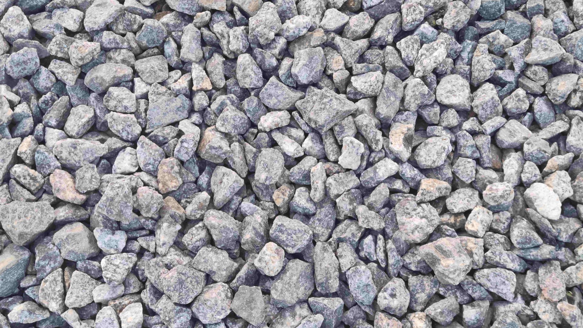 Pile of small gray and tan gravel stones filling the frame.